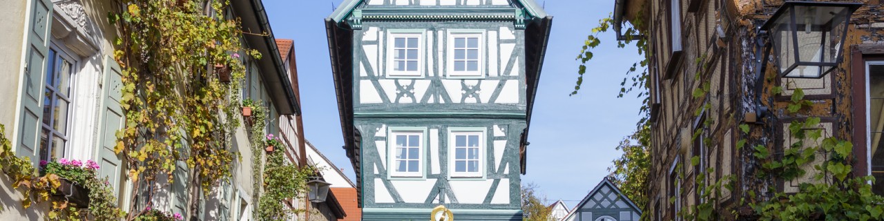 View of a renovated half-timbered house at the end of a street