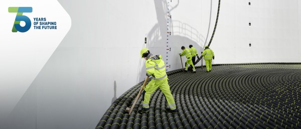 Workers on a submarine cable laying vessel