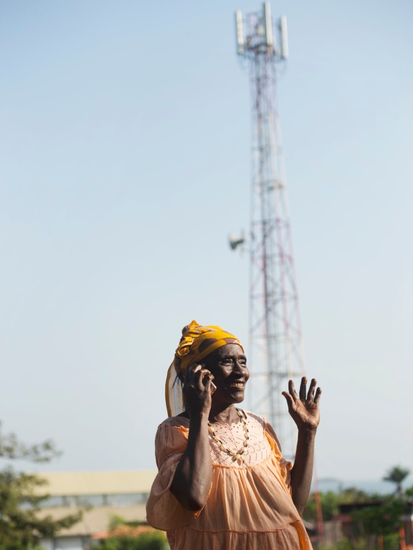 Woman making a phone call in Guinea
