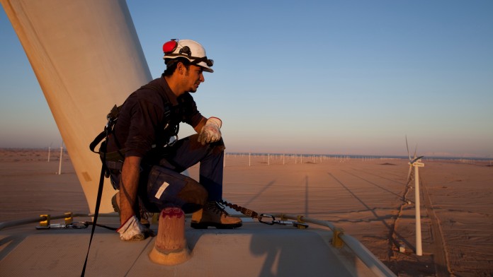 Engineer checking a wind generator in a wind park