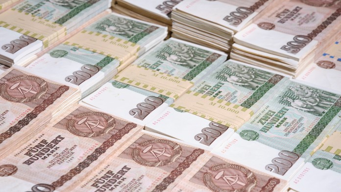 Bundles of 200 and 500 DDR-Mark banknotes.