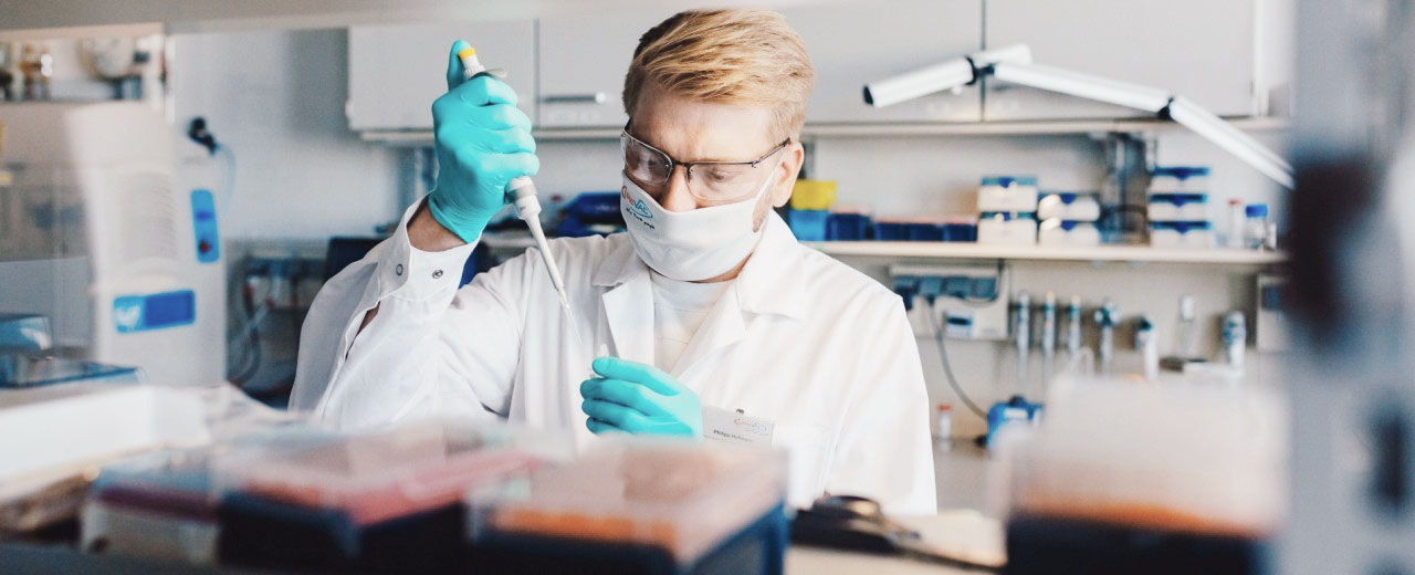 A laboratory technician uses a pipette