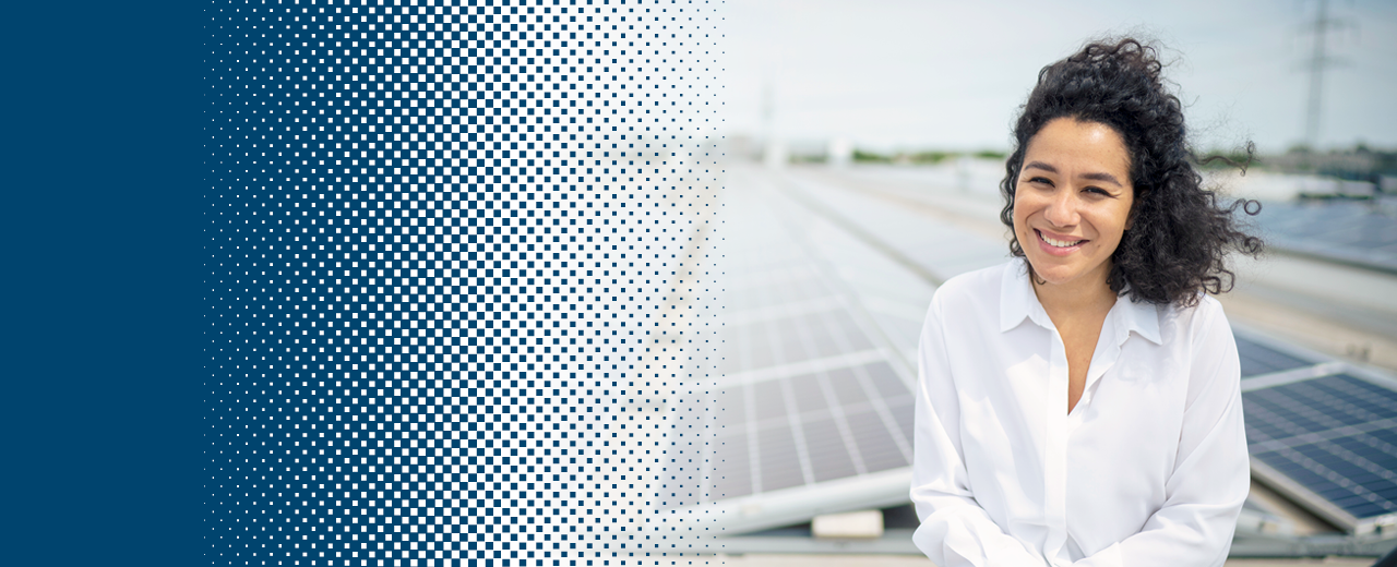 Woman in front of solar panels