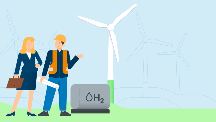 Two people standing in front of a wind farm and a hydrogen storage facility