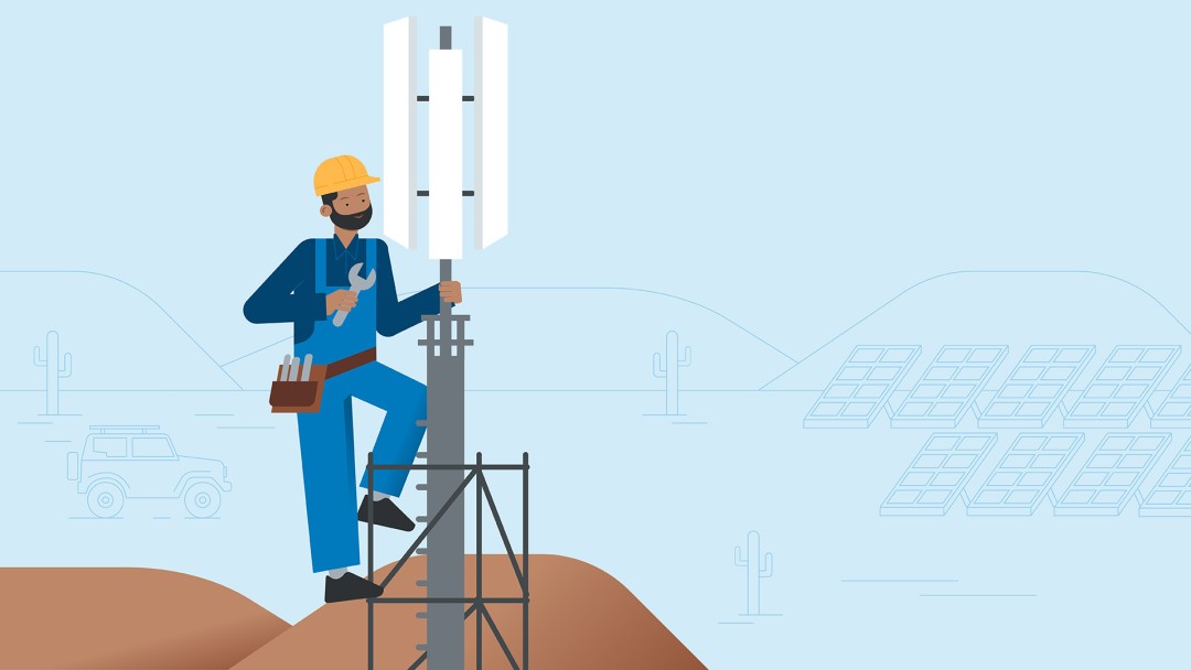 A worker repairs a mobile phone mast in the desert