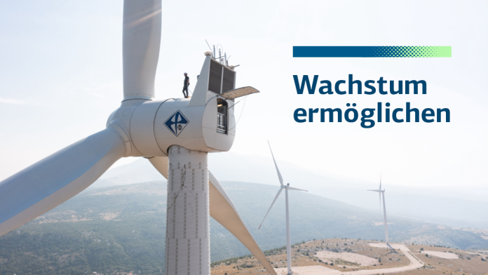 Windrad mit Mensch und Beschriftung "Wirkung ermöglichen"