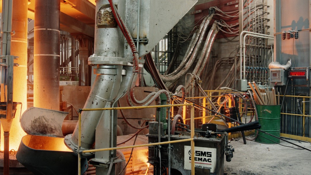 Machine in a steel factory in which red-hot metal is processed