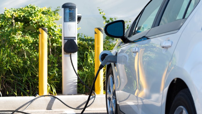 An electric car charging in California
