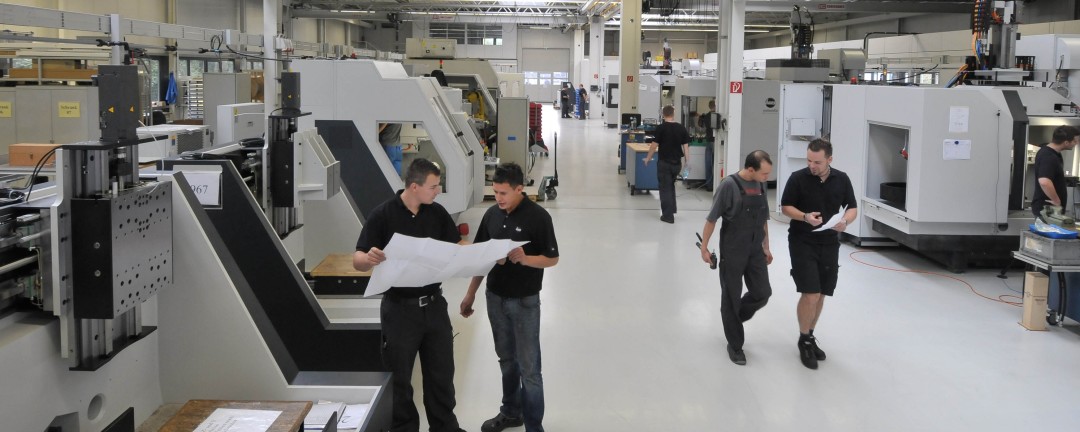 a factory hall with people working
