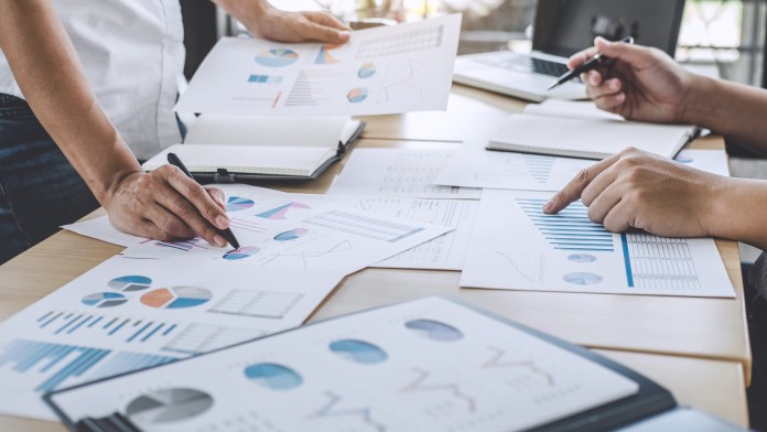 Business team meeting working with new startup project, discussion and analysis data the charts and graphs, laptop using, Business finances and accounting concept.