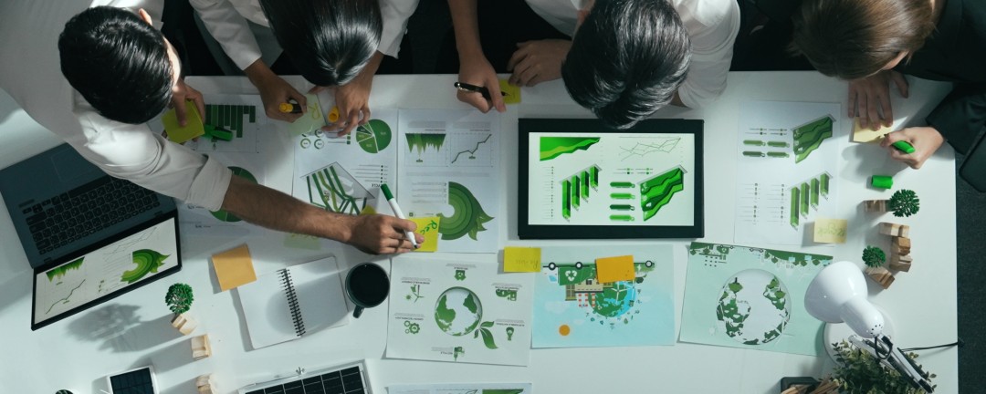 Top view of executive manager hold tablet display clean energy at meeting.