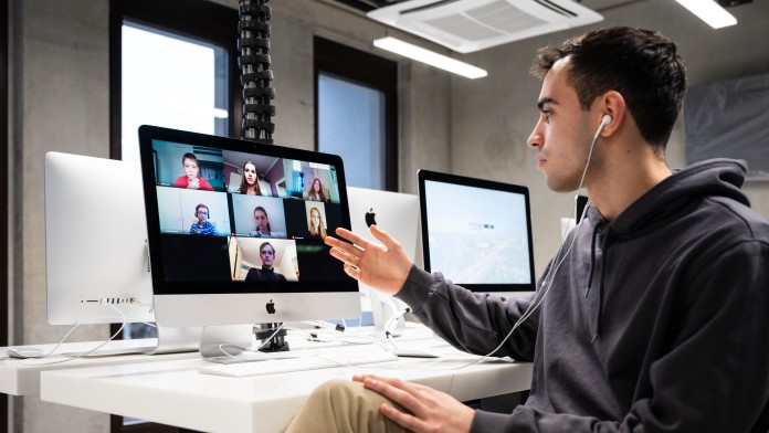 Coach with students during online lessons at the new Tumo Center in Berlin