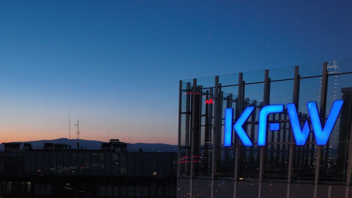 KfW logo on the main building in the evening sky
