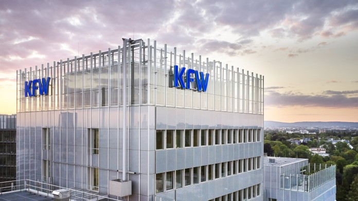 Aerial view of the KfW Main Building in Frankfurt shortly after sunset. 