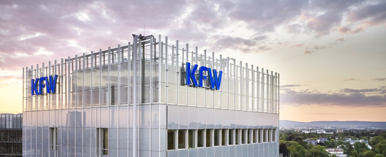 Aerial view of the KfW Main Building in Frankfurt shortly after sunset. 