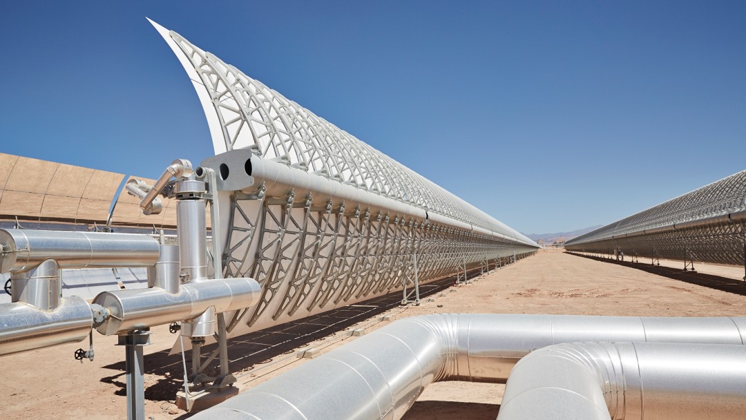 View of a solar power plant in the desert, close-up view of some rows of solar panels
