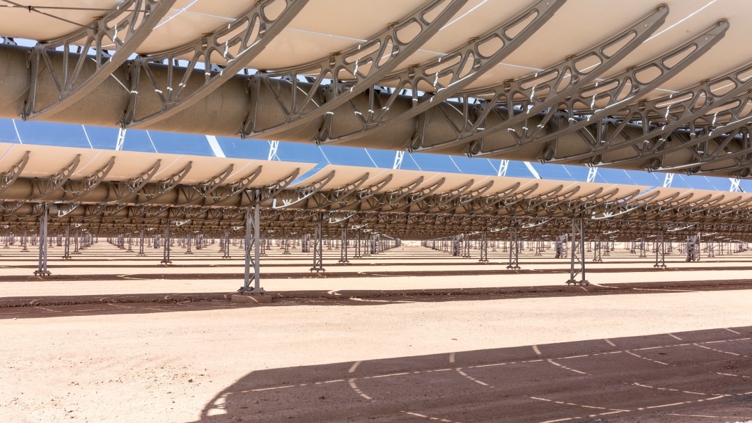 View of a solar power plant in the desert, close-up view of some rows of solar panels