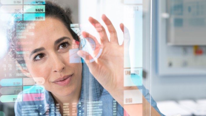 Woman working on a transparent screen