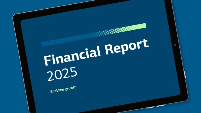 A tablet displays the text: “Financial Report 2025: Enabling growth”