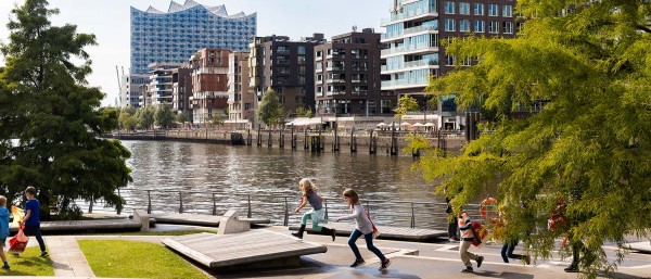 modern residential complex on the waterfront with Elbphilamonie in the background