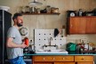 Lutz-Rainer Müller in his kitchen with old furniture