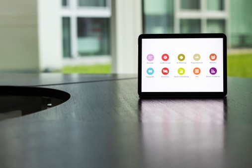 A tablet screen displays various work options