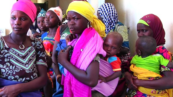 Young mothers carrying babies on their backs