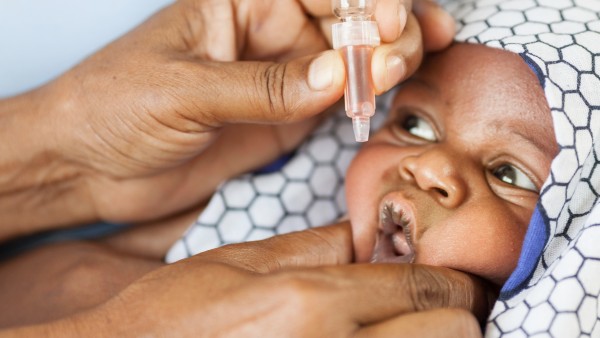 Baby receives polio vaccination