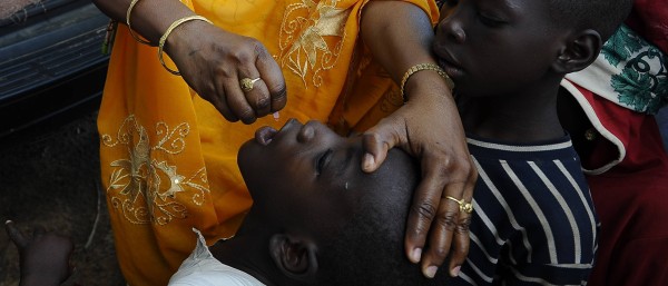 A child in Nigeria receives Polio vaccination