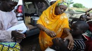 A child in Nigeria receives Polio vaccination