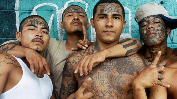 Gang members in Central America pose for the camera