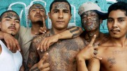 Gang members in Central America pose for the camera