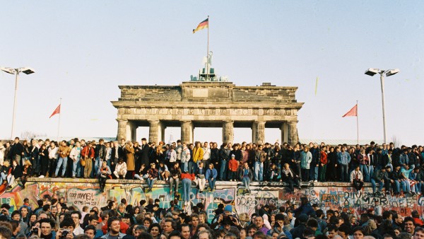 Crowd on and in front of Berlin Wall at Brandenburg Gate