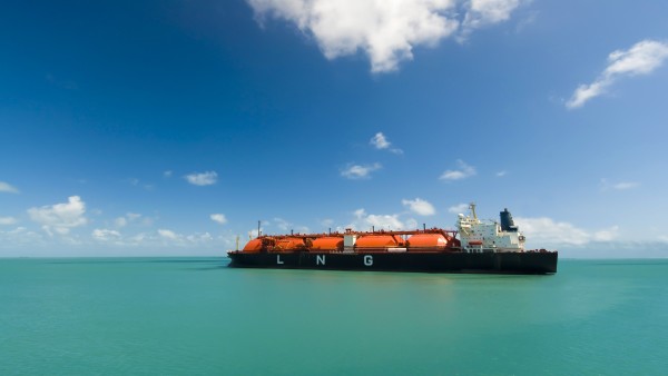 A large Liquid Natural Gas tanker is sailing on the sea.