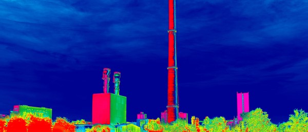 Thermal image of production facility with free standing chimney
