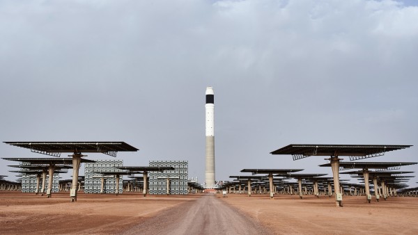 Solar tower between concrete pylons