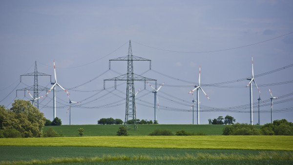 Landscape with power poles and wind wheels
