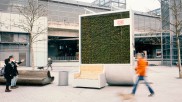 A CityTree in front of a train station