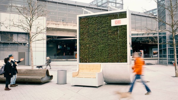 A CityTree in front of a train station