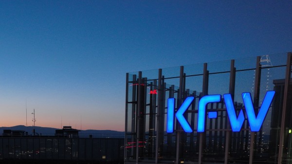 KfW logo on the main house after dark