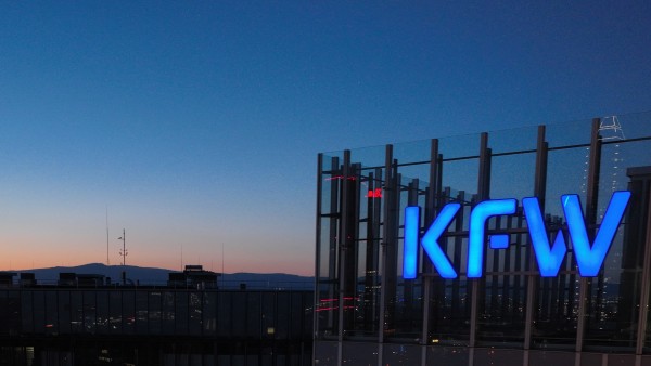 KfW logo on the main house after dark