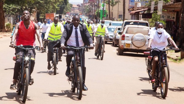 A group of e-cyclists in a street