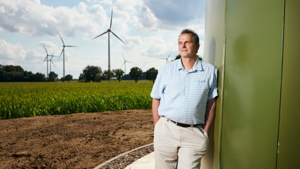 mayor Weber in front of wind turbine