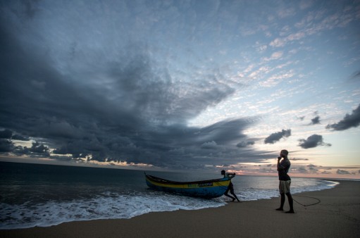 Fisherman with boats on the Ilha de Mafamede, Mozambique. Mafamede is part of the environmental protected area of Primeiras e Segundas