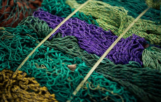 Old, used fishing nets in different colors