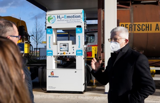 One of the founders of Buses4Future in front of a hydrogen gas pump.