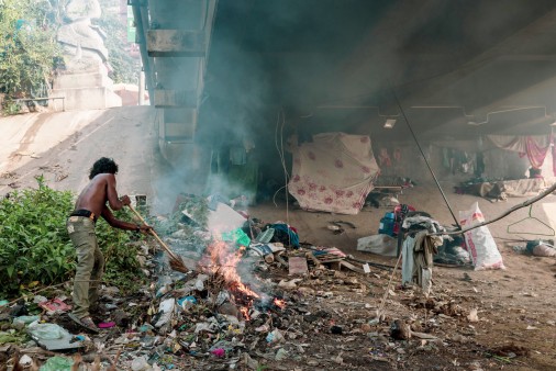 Man burning garbage on the streets
