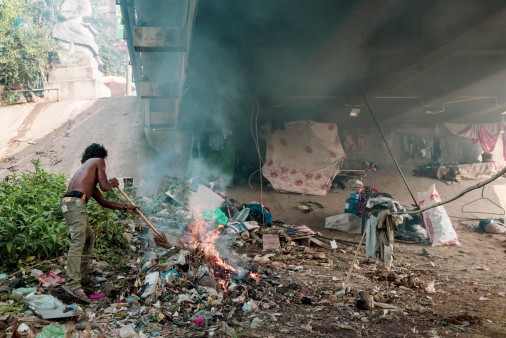 Man burning garbage on the streets