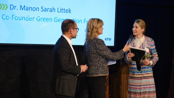 Sarah Littek receives award on stage