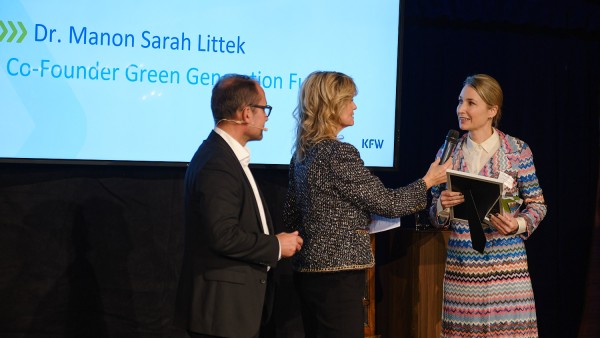 Sarah Littek receives award on stage